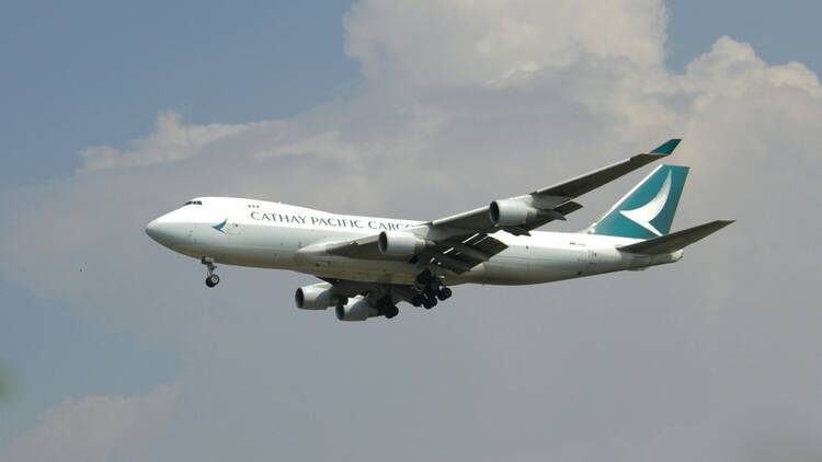 Cathay Pacific plane flying in sky