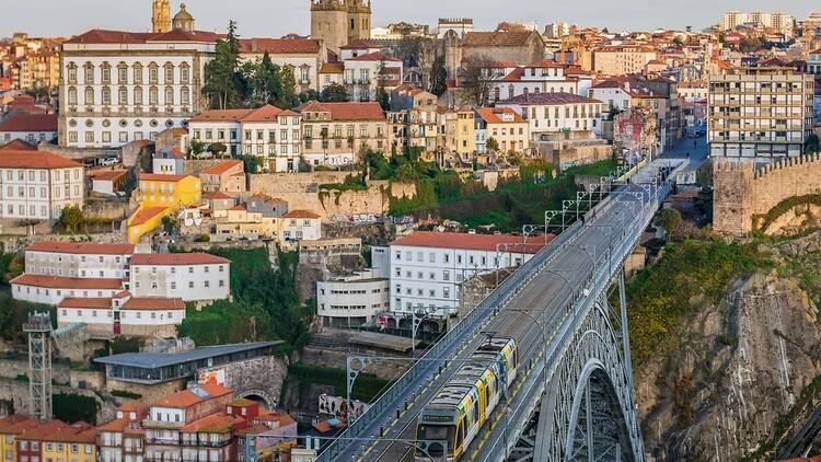 Porto cityscape with rail bridge in foreground