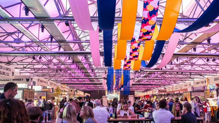 Indoor food festival with steamers on roof