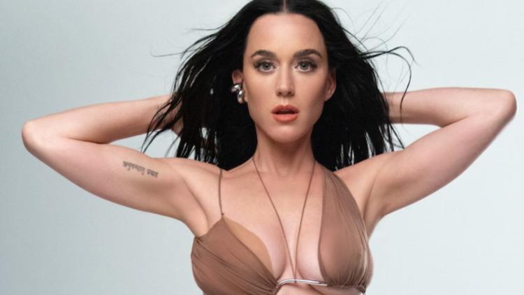 Katy Perry with her hands behind her head