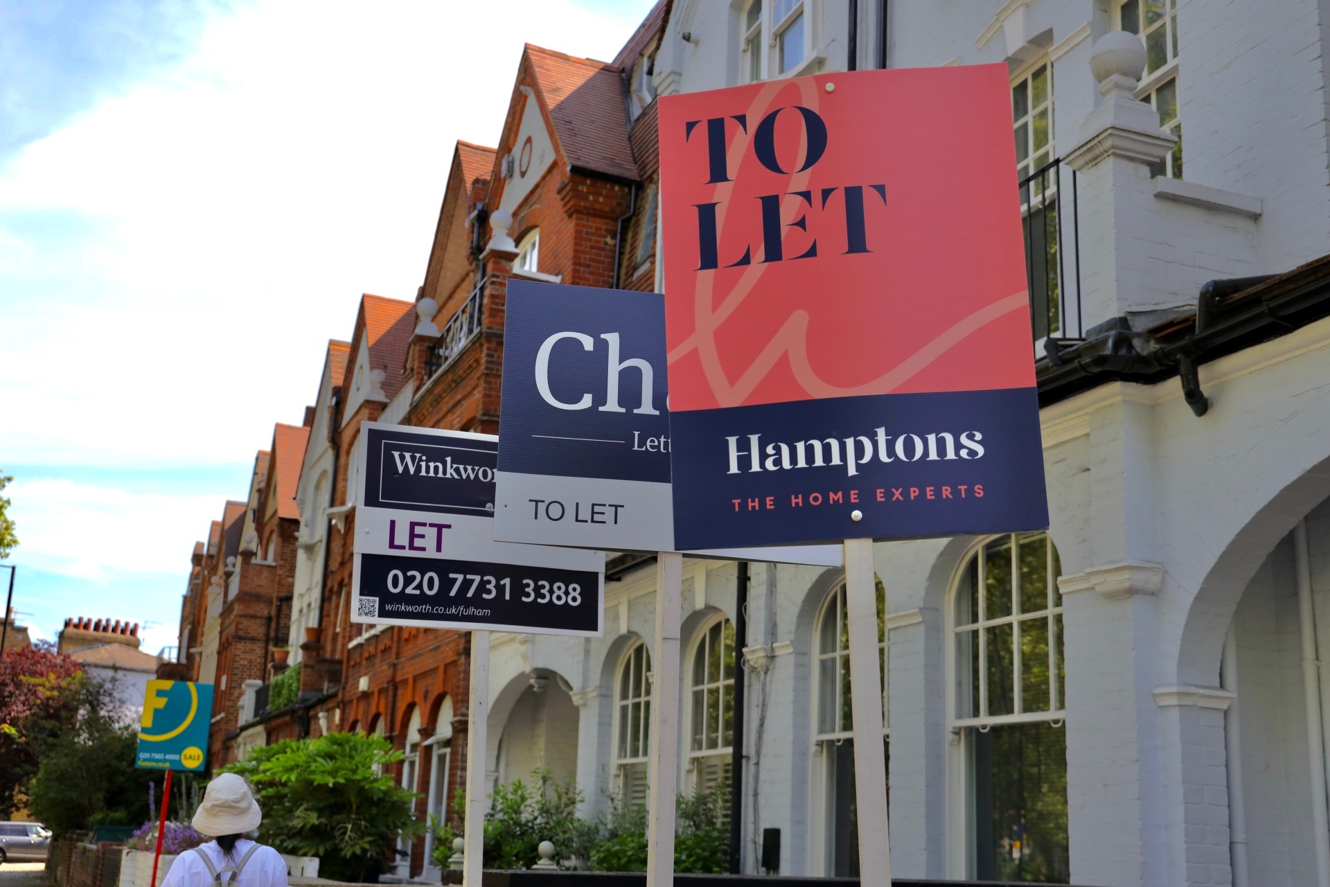 A street with 'to let' signs