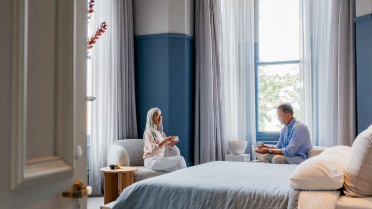 Pair of guests sitting in their peaceful suite at Hotel Vera.