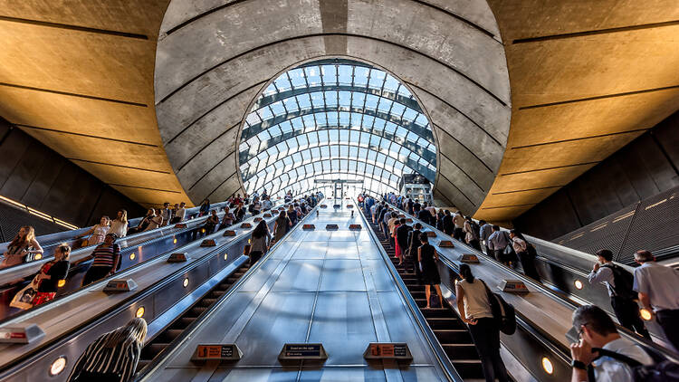 Passengers on the escalators at the Canary Wharf Jubilee line station in London. 