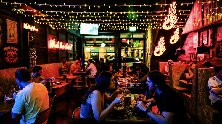 People eating wings at a diner 