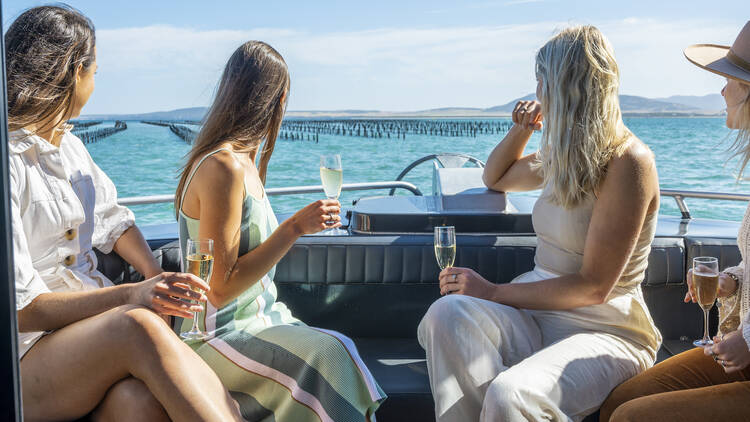 Girls having Champagne on boat 