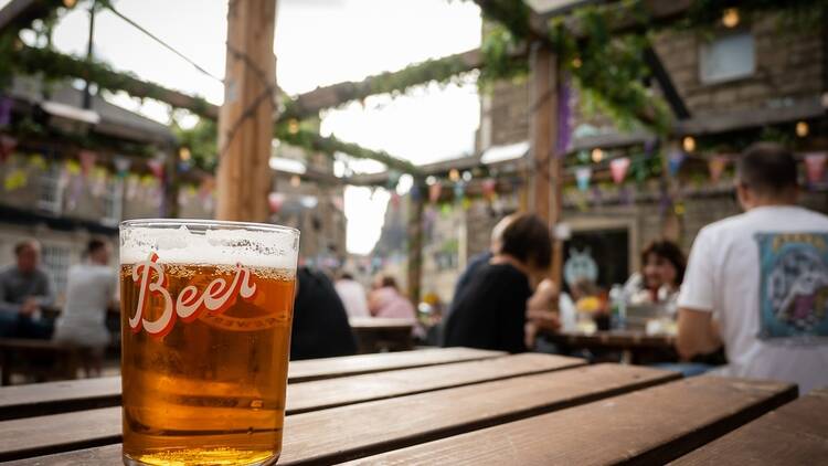 A pint of beer on a pub table in Edinburgh