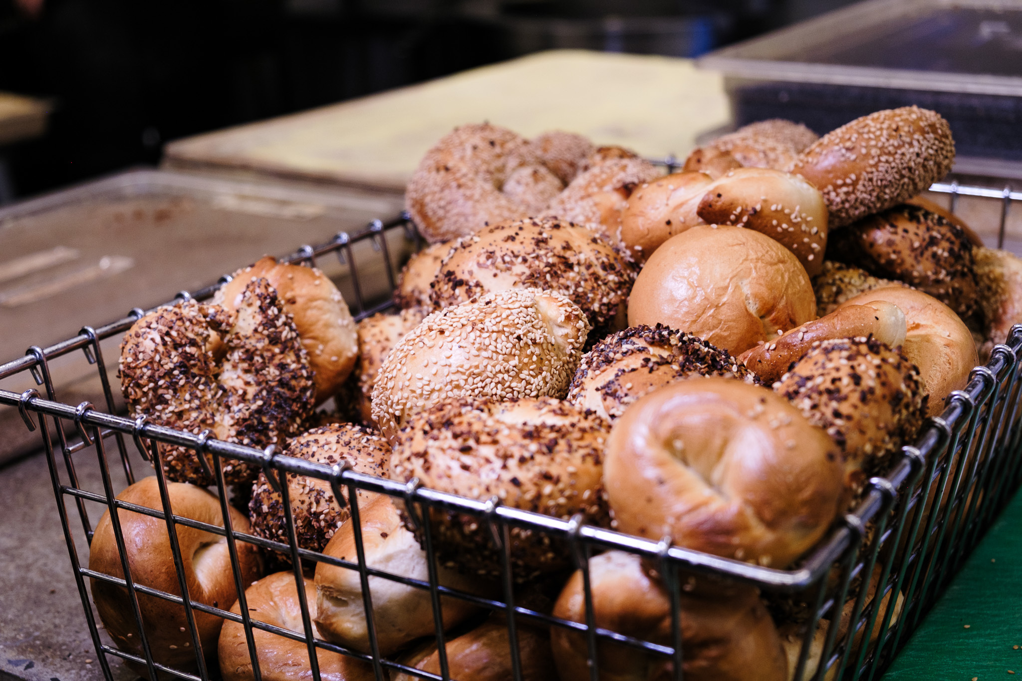 A metal rack full of bagels