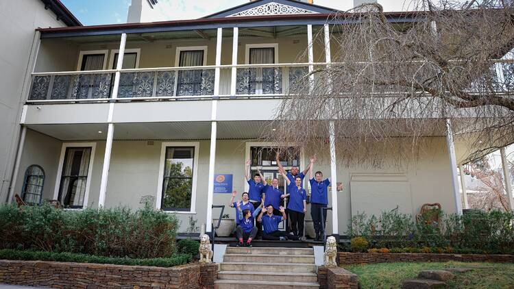 Staff standing outside of hotel