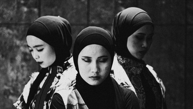 Three women in a black and white photograph 