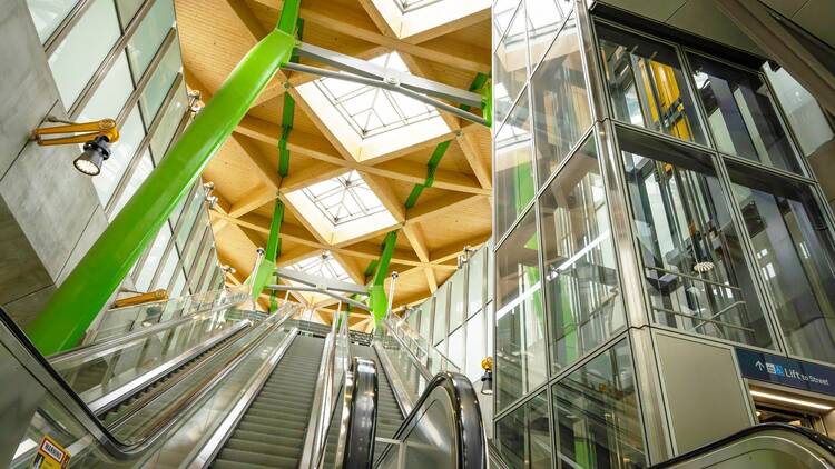 The intricate roof design and escalators of Anzac Station.