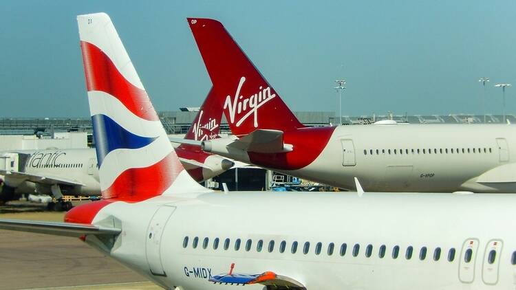 Airplanes at an airport with British Airlines Virgin Atlantic