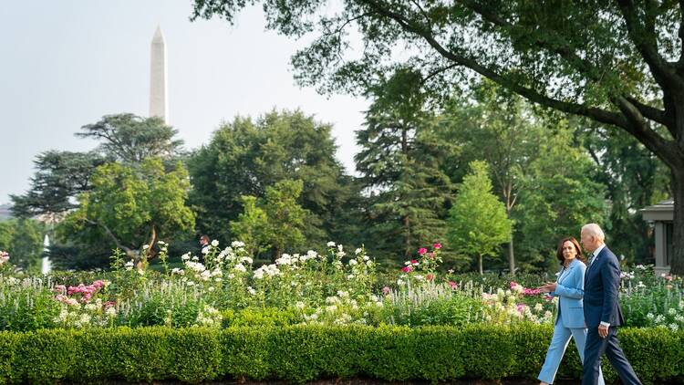 President Joe Biden and Vice President Kamala Harris walk and talk through the White House Rose Garden in 2021.