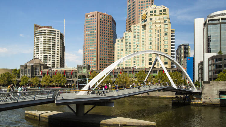 People walking on Evans Walker Bridge