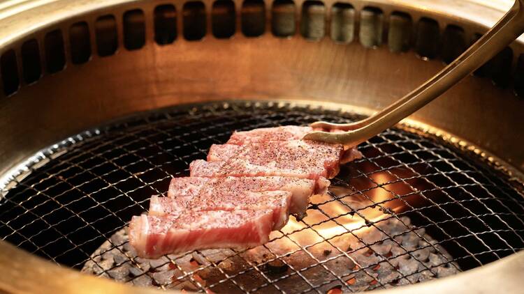 Meat being cooked on a grill