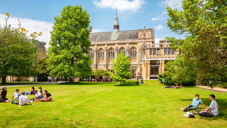 Students on the grass at Balliol College, University of Oxford