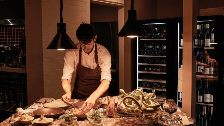 Chef working at the open prep counter.