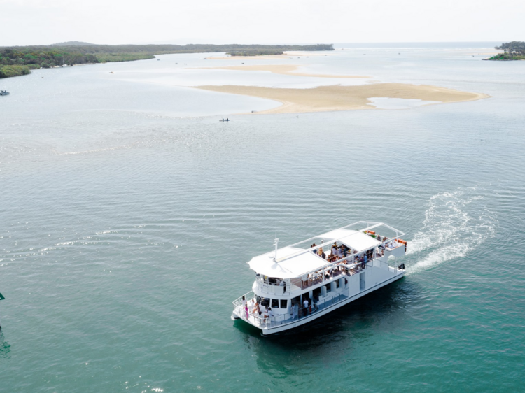 Cruise down Noosa River on a party boat