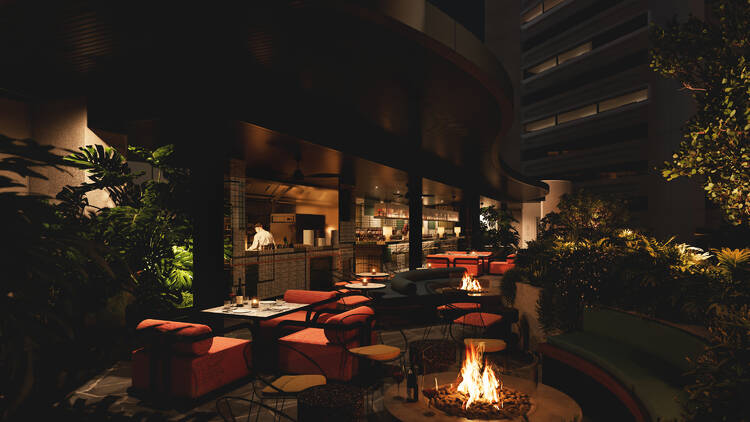 An outdoor dining venue with a fireplace