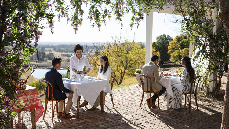 Couple enjoying food and drink at Bistro Molines, Mount View in the Hunter Valley.