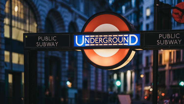 London Underground sign at night