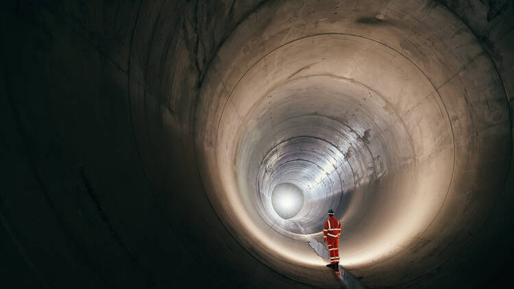 Man standing inside the Thames Tideway Tunnel