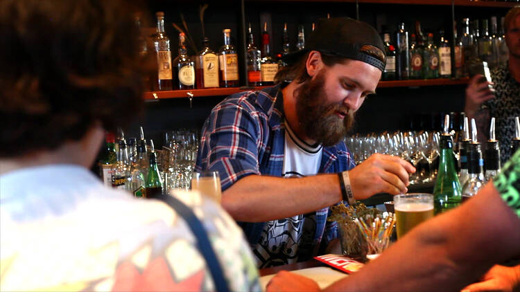 Bartender preparing a drink at Mechanics Institute Bar