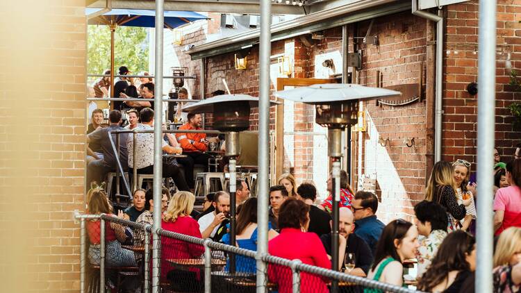 People seated on rooftop bar