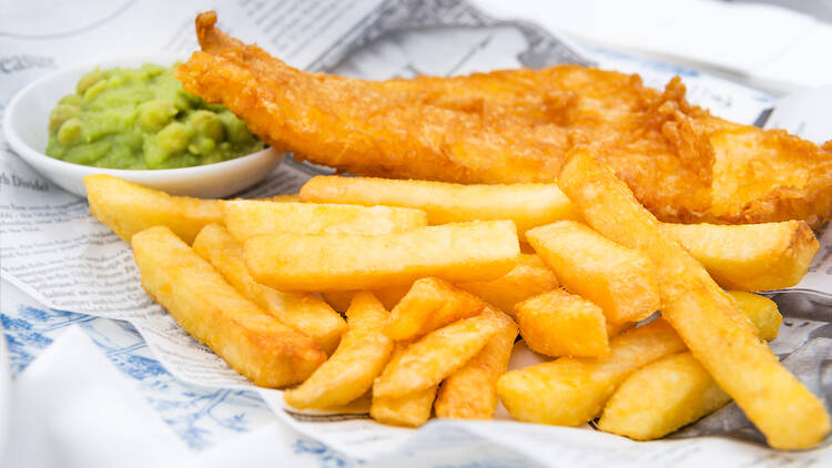 Traditional British fish and chips with mushy peas