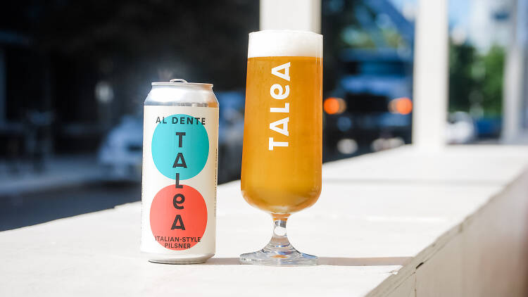 A can of beer and a glass from Talea Beer Co.