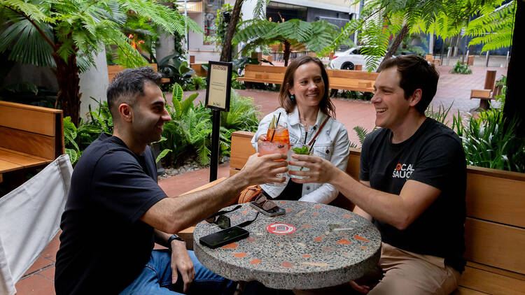 People having cocktails at outdoor bar