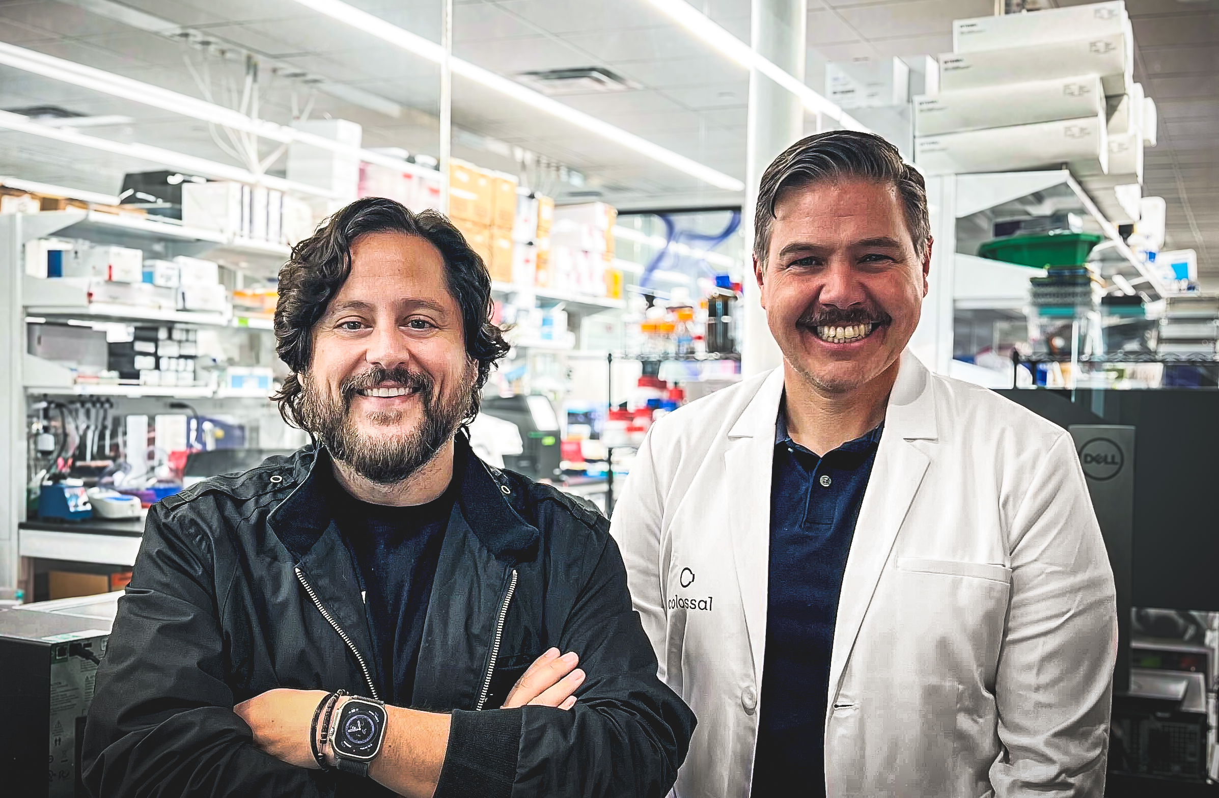 Two scientists smiling at camera