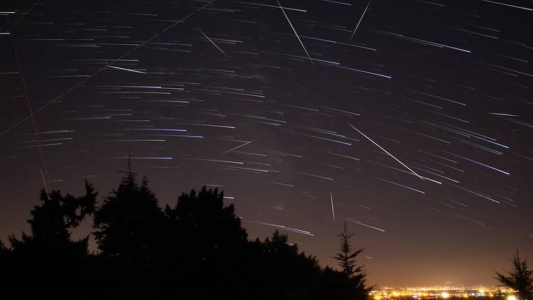 Meteor shower in the night sky