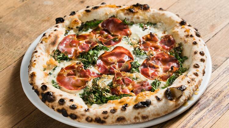 A pizza sitting on a table