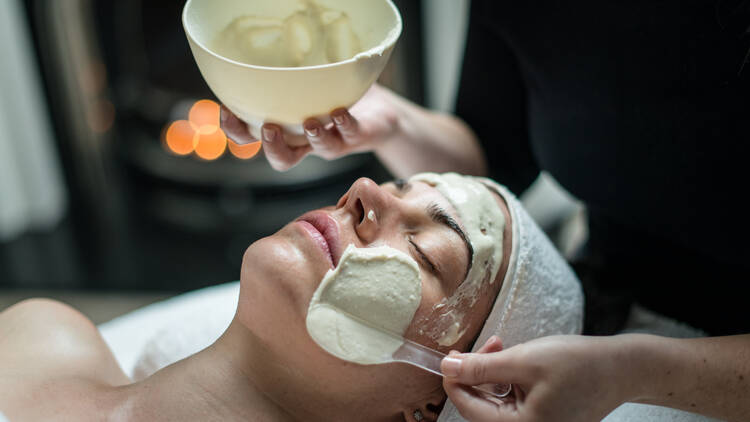 A person enjoying a facial at Shine Skin and Body in Richmond.