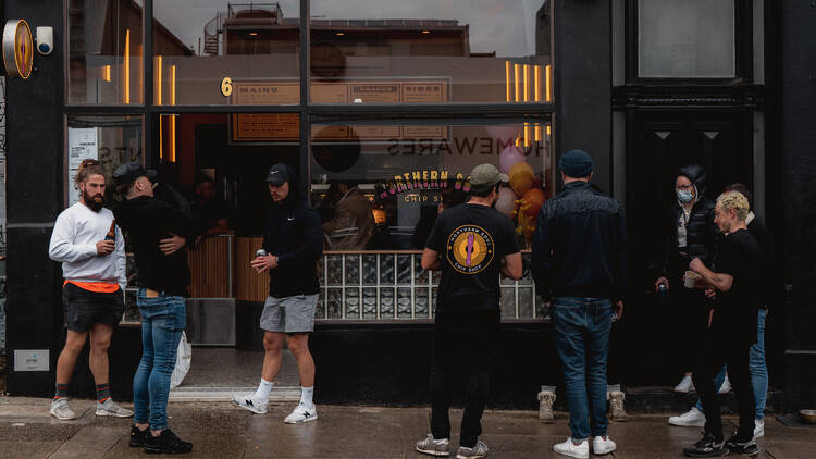 People waiting outside the Northern Soul shopfront in St Kilda.