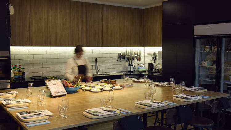 A chef in a communal cooking kitchen.