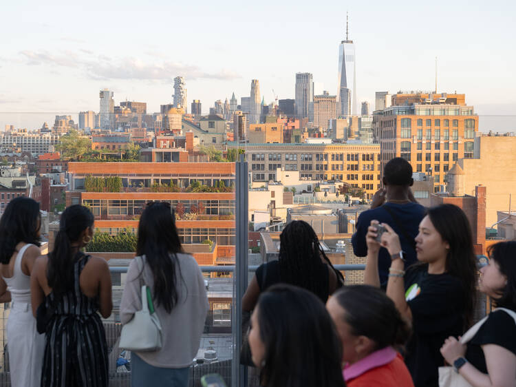 A group of people on the rooftop of the Whitney.