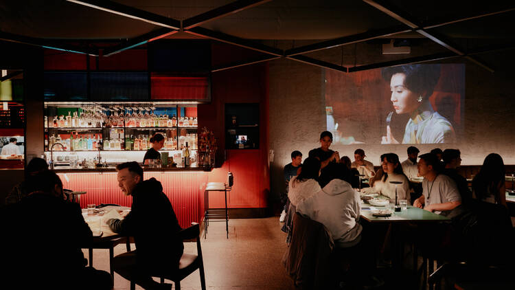 People sitting at tables in a restaurant. 