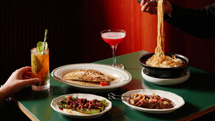 A table filled with plates of food. 