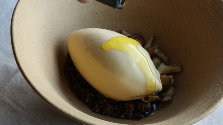 Olive oil being drizzled over a dessert.