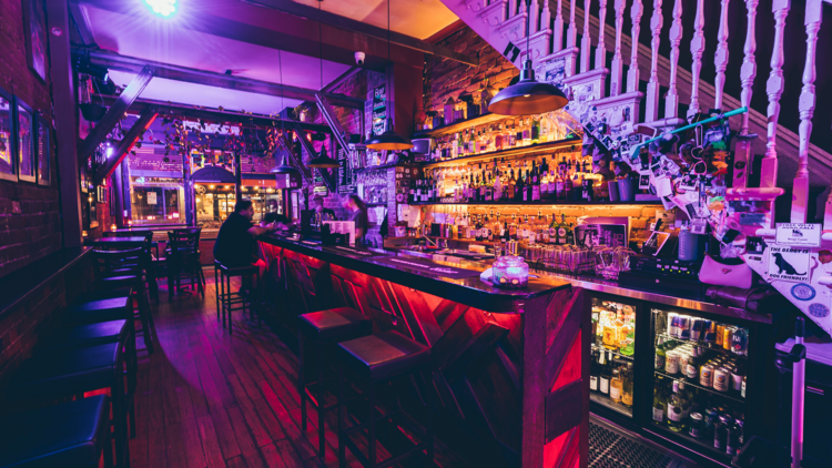 The bar in the Bergy Bandroom lit in purple