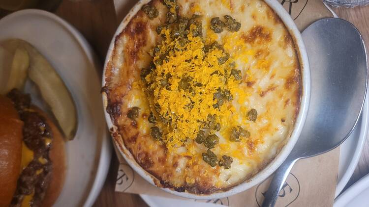 A fish pie with lemon zest and capers on top