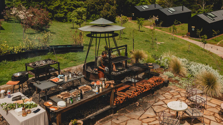 A chef cooking in the open kitchen at Osborn House