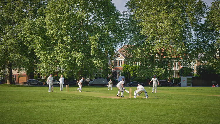 People playing cricket in a park in south London