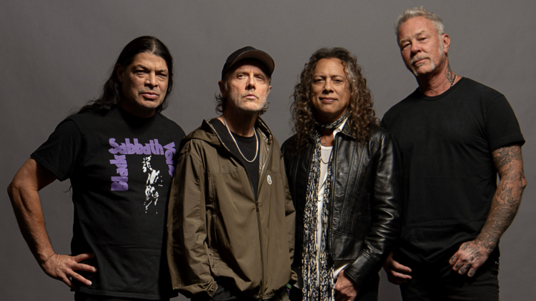 The four members of Metallica standing casually.