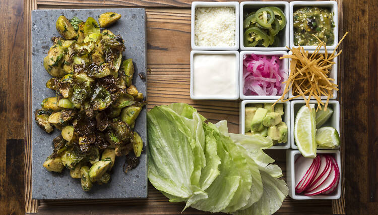 Brussel Sprout tacos with sides of vegetables