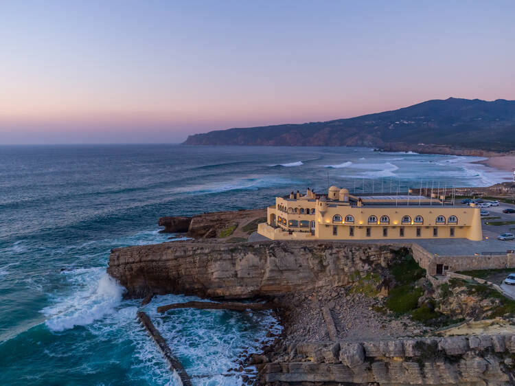 an aerial view of Fortaleza do Guincho at sunset