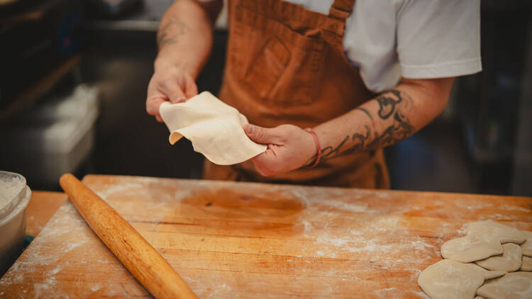 Jorge Aguilar of Border Town works on a taco.