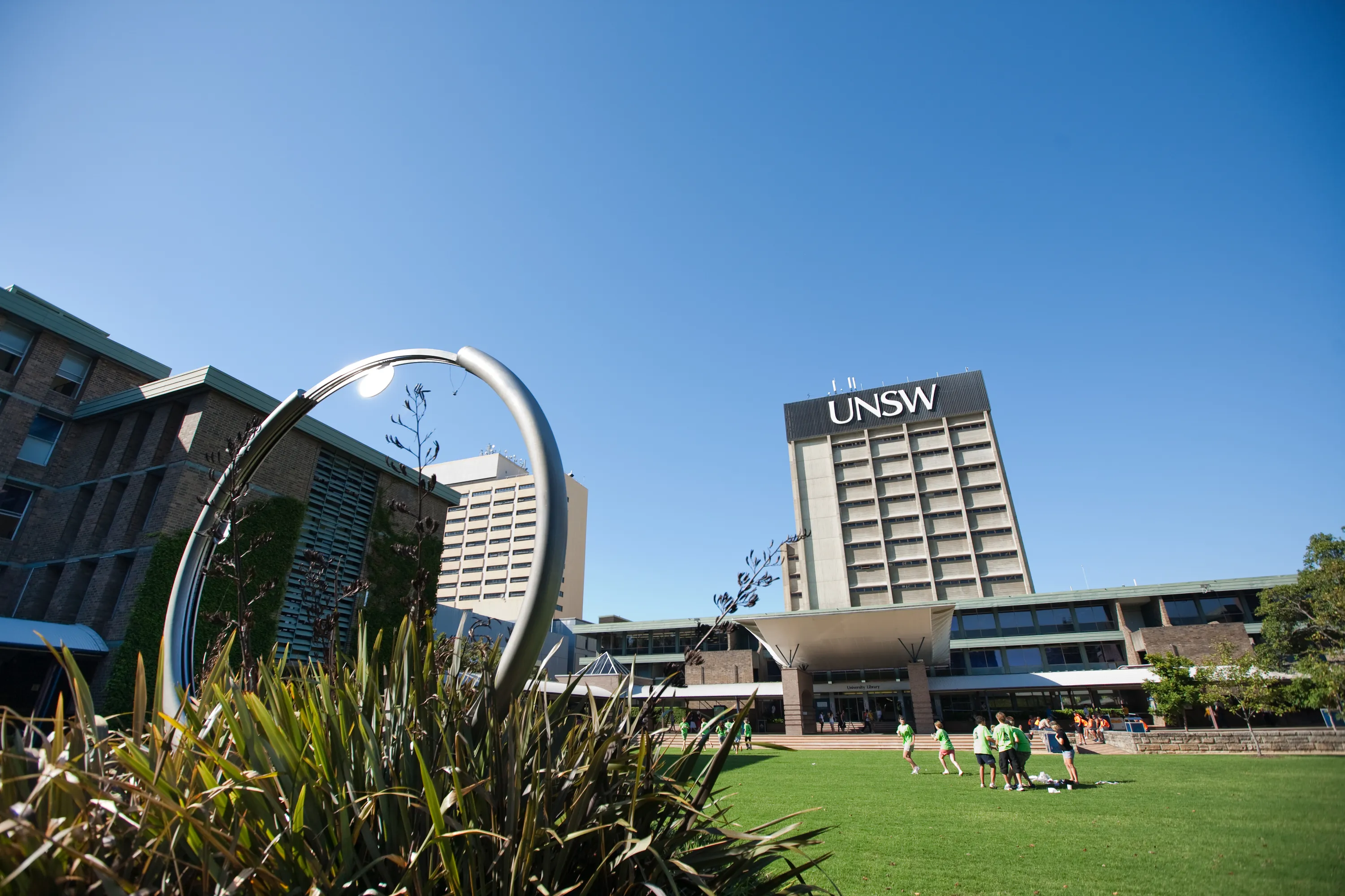 Low angle of UNSW's library lawn with library building in the back