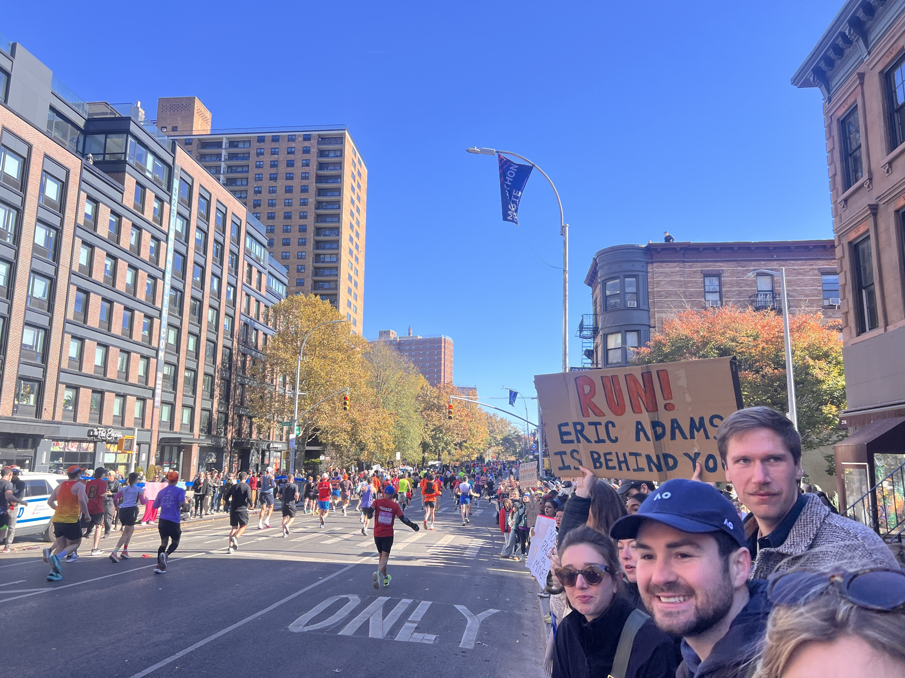 marathon runners and sign